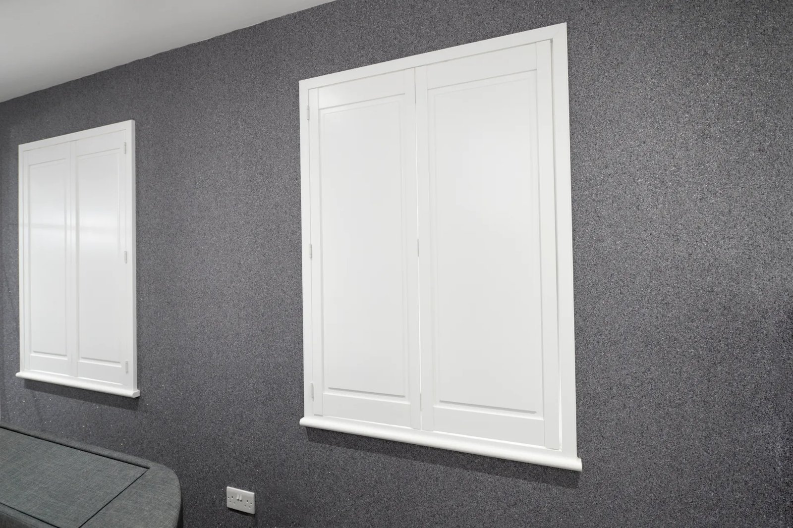 Solid panel shutters with no louvres giving full blackout and privacy
